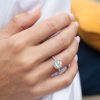 Thalia-Cushion-Cut-Halo-Diamond-Ring-with-Accent-Stones-in-18K-White-Gold-worn