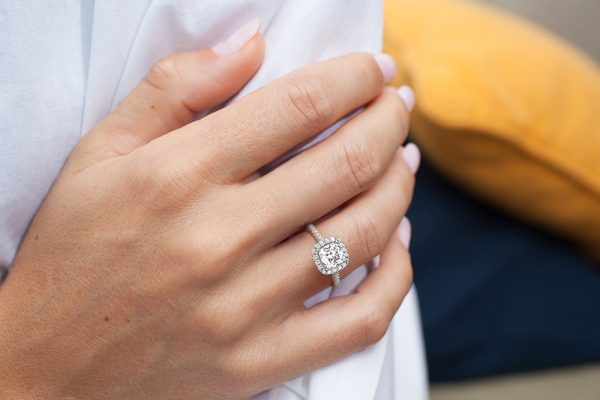 Thalia-Cushion-Cut-Halo-Diamond-Ring-with-Accent-Stones-in-18K-White-Gold-worn