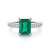 DA00743 Emeraldwith side stones_RR01_lay_front_white_Emerald_Denoised_beauty